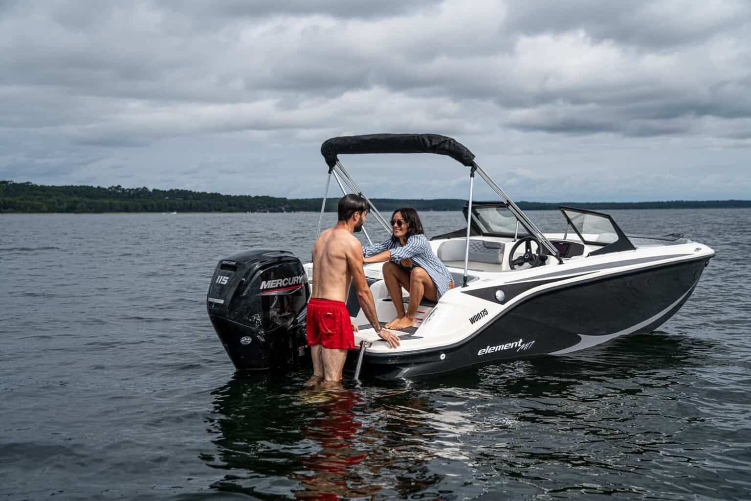 A couple enjoying the Bayliner Element M17 for sale UK at Bates Wharf 