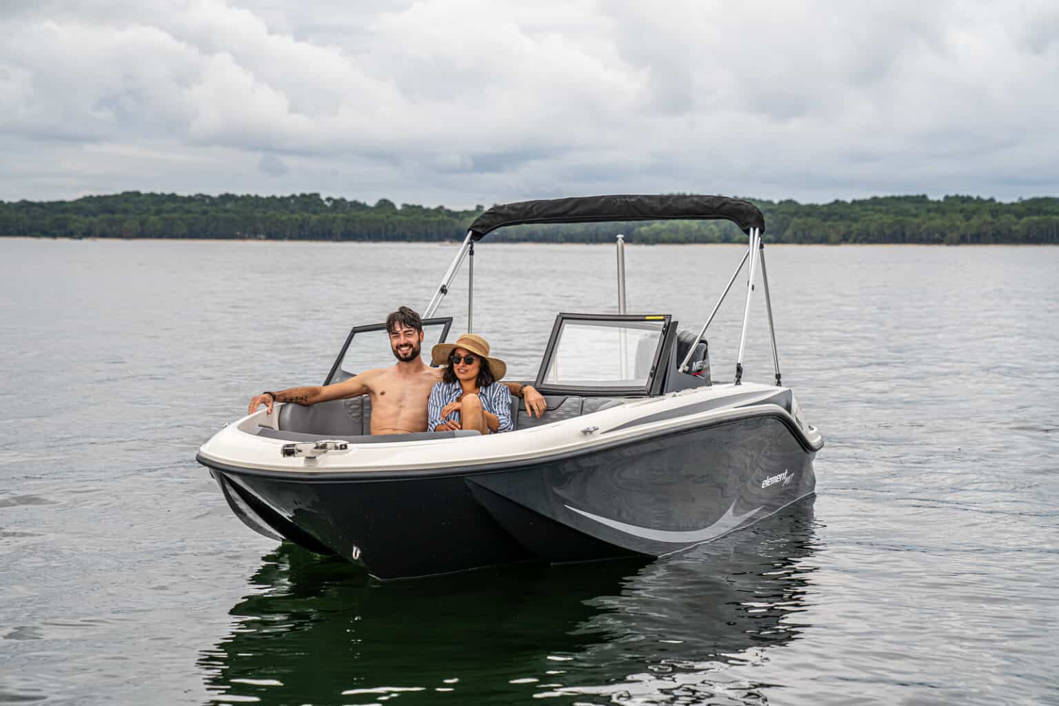 A couple enjoying the Bayliner Element M17 for sale UK at Bates Wharf Marine Sales